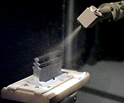 Shot peening of a turbine blade with robotic machine