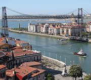 View of Bizkaia Bridge, Bilbao, Spain. The hanging gondola transports personal cars and persons over the Nervion River