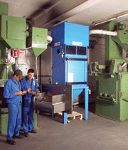 Machine operators prepare the smallest machine (single wheel) to shot peen suspension springs