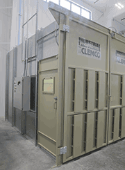 Outside a Clemco PDQ™ Blast Room. These blast rooms come equipped with either a Pneumatic M-Section® or Mechanical partial-floor recovery system.