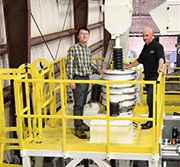 LBTI Design Engineer, Gary Niu discussing media size control in a shot peening machine with Mike Langtry