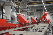 Three AGTOS drum-type blasting machines in an automated process