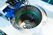 The raw parts are batchwise filled into the container
