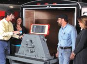 Pangborn employees (l to r) Mat Loutzenheiser, Rachel Andresen, Grant Ebersole and Donna Gordon view the new Genesis wheel mounted in a portable demonstration trailer